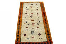 Surface texture of 2000s Persian Gabbeh rug with natural Wool and intricate pattern