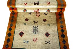 Full view of 2000s Persian Gabbeh rug from Iran / Persia, 187 × 90 cm in Beige tones