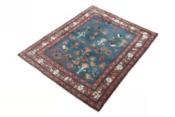 Corner detail of 2000s Persian Gabbeh rug showing border pattern and Wool pile