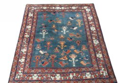 Surface texture of 2000s Persian Gabbeh rug with natural Wool and intricate pattern