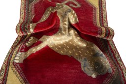 Corner detail of 2000s Persian Gabbeh rug showing border pattern and Wool pile