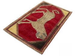 Corner detail of 2000s Persian Gabbeh rug showing border pattern and Wool pile