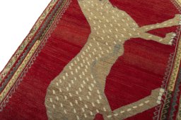 Backside of handmade 2000s Persian Gabbeh rug showing knot structure and weave density
