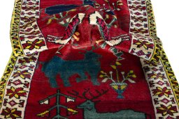 Corner detail of 2000s Persian Gabbeh rug showing border pattern and Wool pile