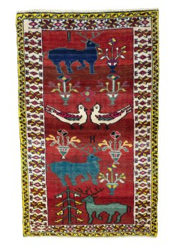 Full view of 2000s Persian Gabbeh rug from Iran / Persia, 177 × 110 cm in Red tones