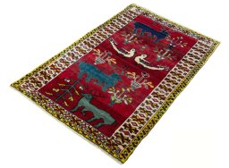 Corner detail of 2000s Persian Gabbeh rug showing border pattern and Wool pile