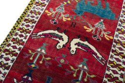 Backside of handmade 2000s Persian Gabbeh rug showing knot structure and weave density