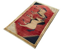 Corner detail of 2000s Persian Gabbeh rug showing border pattern and Wool pile