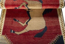 Full view of 2000s Persian Gabbeh rug from Iran / Persia, 177 × 105 cm in Red tones