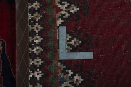 Surface texture of 2000s Persian Gabbeh rug with natural Wool and intricate pattern