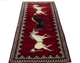 Surface texture of 2000s Persian Gabbeh rug with natural Wool and intricate pattern