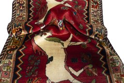 Corner detail of 2000s Persian Gabbeh rug showing border pattern and Wool pile