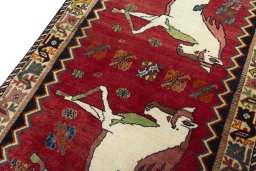 Backside of handmade 2000s Persian Gabbeh rug showing knot structure and weave density