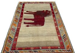 Surface texture of 2000s Persian Gabbeh rug with natural Wool and intricate pattern