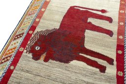 Backside of handmade 2000s Persian Gabbeh rug showing knot structure and weave density