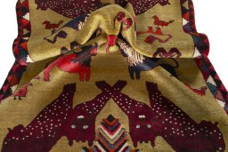 Corner detail of 2000s Persian Gabbeh rug showing border pattern and Wool pile