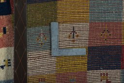 Close-up detail of 2000s Persian Gabbeh rug from Iran / Persia showing Wool weave