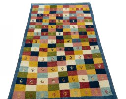 Surface texture of 2000s Persian Gabbeh rug with natural Wool and intricate pattern