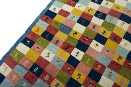Backside of handmade 2000s Persian Gabbeh rug showing knot structure and weave density