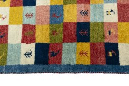 Close-up detail of 2000s Persian Gabbeh rug from Iran / Persia showing Wool weave
