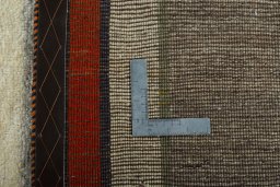 Close-up detail of 2000s Persian Gabbeh rug from Iran / Persia showing Wool weave