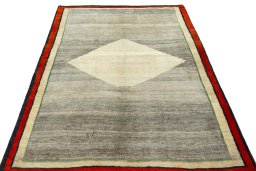 Surface texture of 2000s Persian Gabbeh rug with natural Wool and intricate pattern