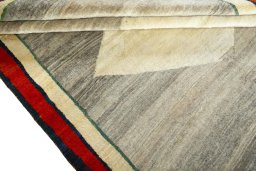 Full view of 2000s Persian Gabbeh rug from Iran / Persia, 275 × 197 cm in Beige tones