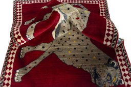 Corner detail of 2000s Persian Gabbeh rug showing border pattern and Wool pile