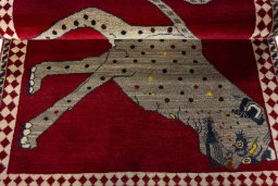 Full view of 2000s Persian Gabbeh rug from Iran / Persia, 145 × 103 cm in Red tones
