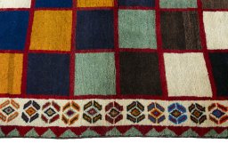 Close-up detail of 2000s Persian Gabbeh rug from Iran / Persia showing Wool weave