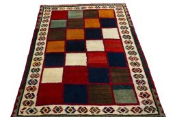 Surface texture of 2000s Persian Gabbeh rug with natural Wool and intricate pattern