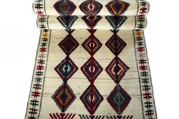 Full view of 2000s Persian Gabbeh rug from Iran / Persia, 213 × 86 cm in Beige tones