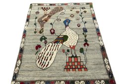 Surface texture of 2000s Persian Gabbeh rug with natural Wool and intricate pattern