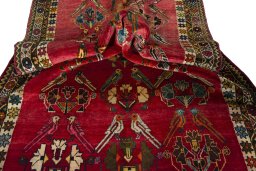 Corner detail of 2000s Persian Gabbeh rug showing border pattern and Wool pile