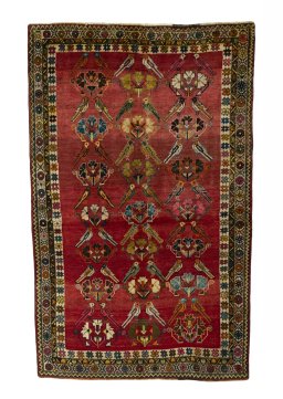Full view of 2000s Persian Gabbeh rug from Iran / Persia, 250 × 157 cm in Red tones