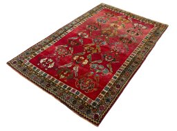 Corner detail of 2000s Persian Gabbeh rug showing border pattern and Wool pile