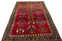 Surface texture of 2000s Persian Gabbeh rug with natural Wool and intricate pattern