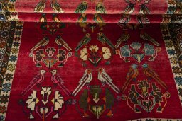 Full view of 2000s Persian Gabbeh rug from Iran / Persia, 250 × 157 cm in Red tones