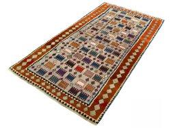 Corner detail of 2000s Persian Gabbeh rug showing border pattern and Wool pile