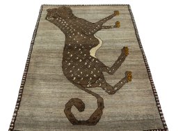 Surface texture of 2000s Persian Gabbeh rug with natural Wool and intricate pattern