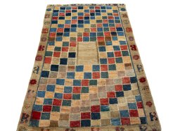 Surface texture of 2000s Persian Gabbeh rug with natural Wool and intricate pattern