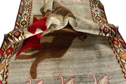 Corner detail of 2000s Persian Gabbeh rug showing border pattern and Wool pile