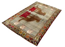 Corner detail of 2000s Persian Gabbeh rug showing border pattern and Wool pile