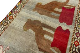 Backside of handmade 2000s Persian Gabbeh rug showing knot structure and weave density