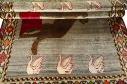 Full view of 2000s Persian Gabbeh rug from Iran / Persia, 247 × 160 cm in Beige tones