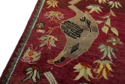 Backside of handmade 2000s Persian Gabbeh rug showing knot structure and weave density