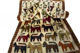 Corner detail of 2000s Persian Gabbeh rug showing border pattern and Wool pile