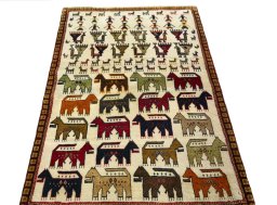Surface texture of 2000s Persian Gabbeh rug with natural Wool and intricate pattern