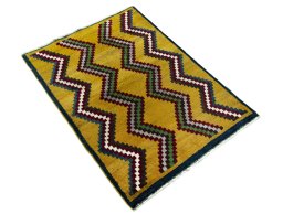 Close-up detail of 2000s Persian Gabbeh rug from Iran / Persia showing Wool weave