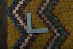 Full view of 2000s Persian Gabbeh rug from Iran / Persia, 97 × 73 cm in Yellow tones